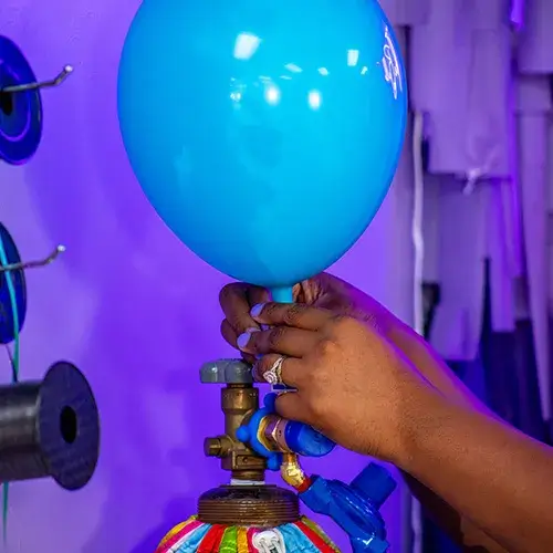 Airing up a blue balloon